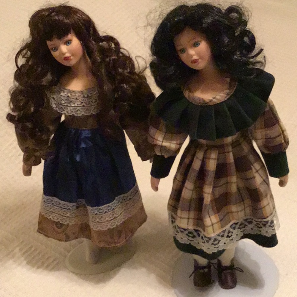 Porcelain Dolls one black hair one brown haired.